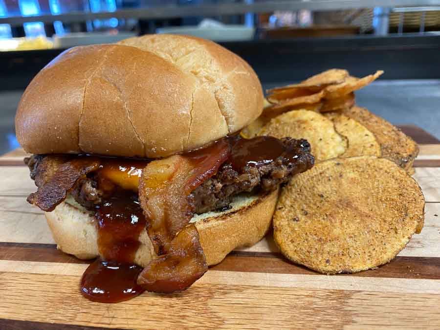 BubbaJ Bacon Burger - Blue J's Rollin' Grill BubbaJ - Signature patty, smoked bacon, cheddar cheese, and mild BBQ sauce