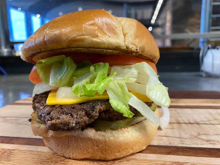 American Classic Cheeseburger - Blue J's Rollin' Grill American Classic - Signature patty with cheese served with dill pickles, onion, tomato, and lettuce